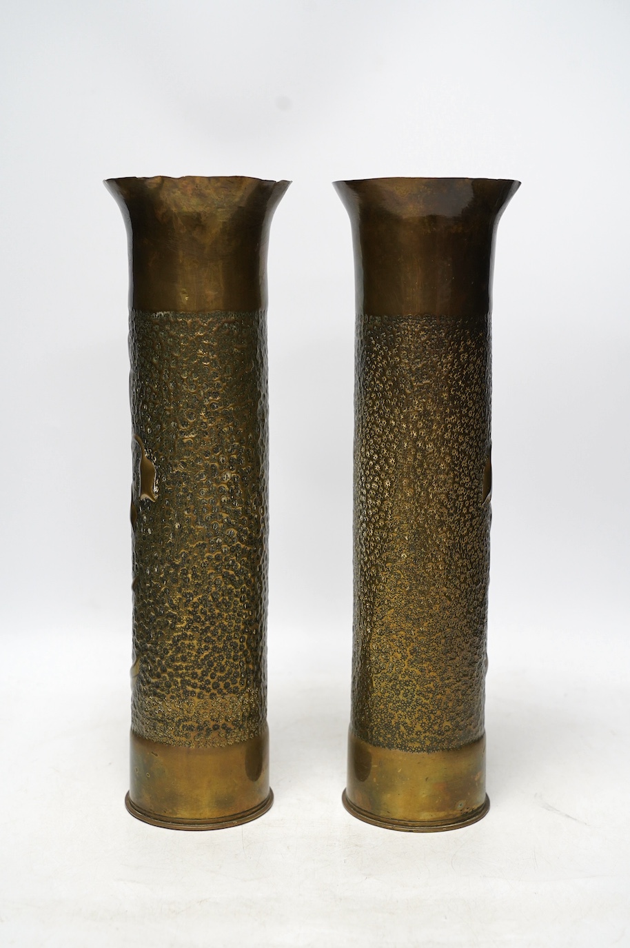 A pair of Trench Art shell case vases, 35cm. Condition - fair